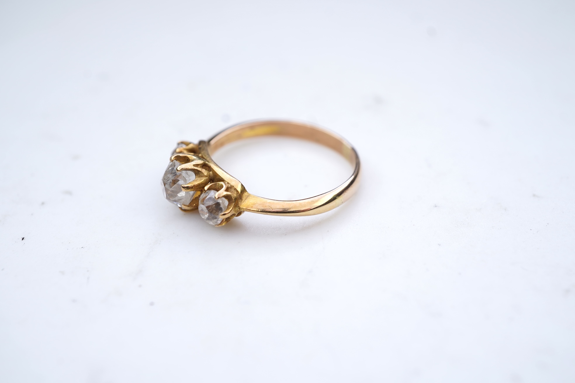 A three-stone diamond ring, early 20th century